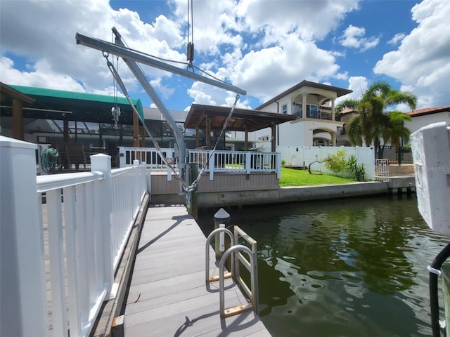 view of dock featuring a deck with water view