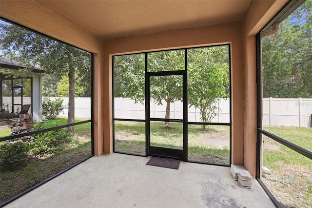 unfurnished sunroom with a healthy amount of sunlight