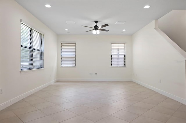 unfurnished room featuring light tile patterned floors, recessed lighting, a ceiling fan, and baseboards