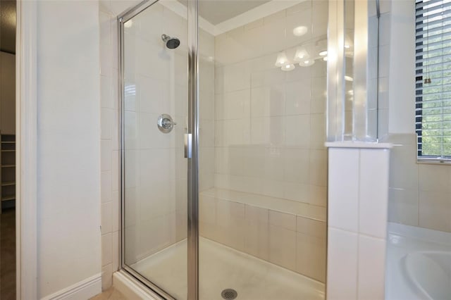 full bath with a shower stall and a bath