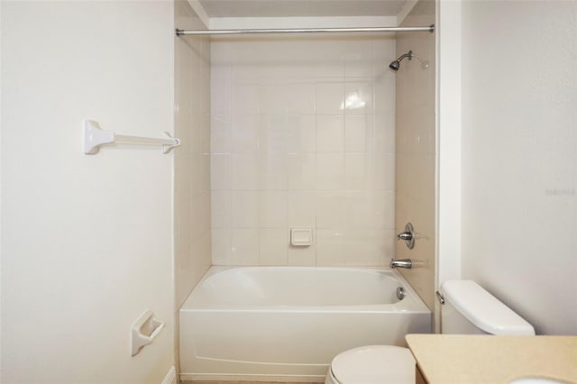 bathroom with toilet, shower / washtub combination, and vanity