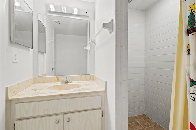 bathroom featuring vanity and curtained shower