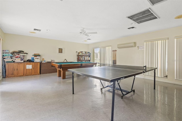 game room with ceiling fan, an AC wall unit, and pool table