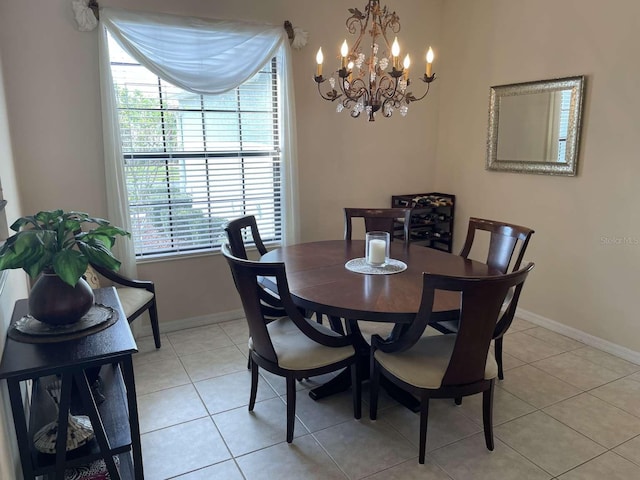 tiled dining area with a notable chandelier