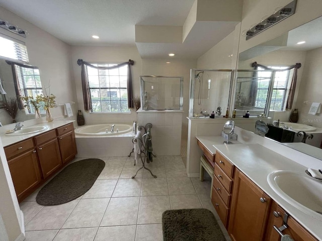 bathroom featuring vanity, separate shower and tub, and tile patterned floors