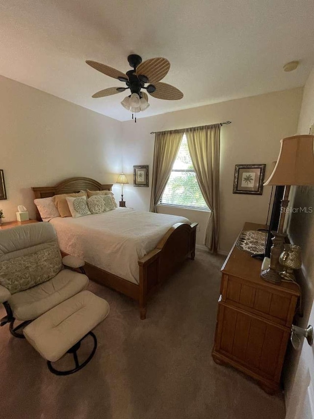 bedroom with ceiling fan and carpet floors