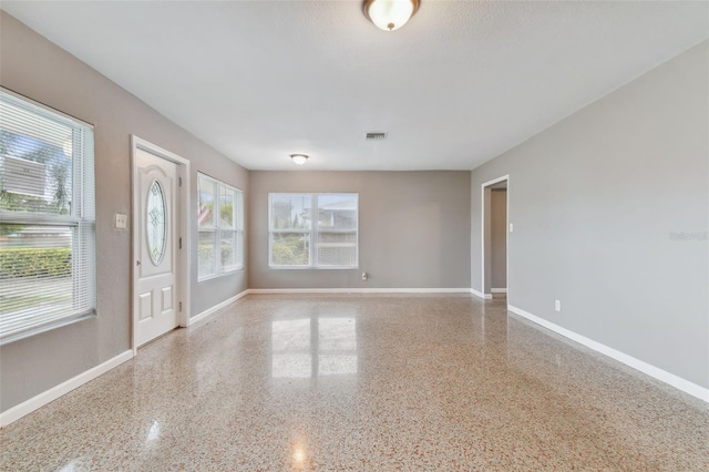 spare room featuring plenty of natural light