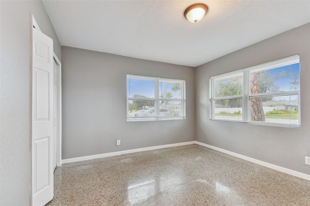 empty room with a textured ceiling