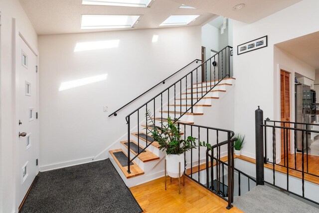 stairway with wood-type flooring