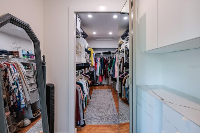 walk in closet featuring light hardwood / wood-style flooring