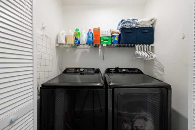 washroom with washing machine and dryer