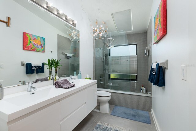 bathroom with tile patterned flooring, vanity, and toilet