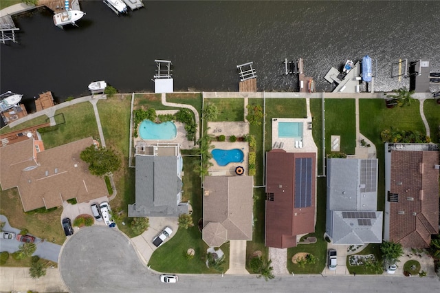 birds eye view of property with a water view