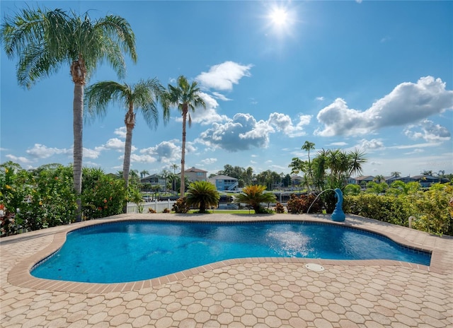 outdoor pool featuring a patio area