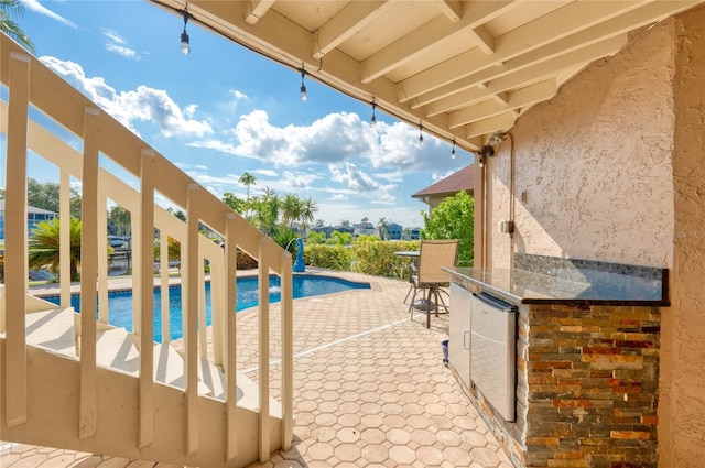 view of patio / terrace with an outdoor pool