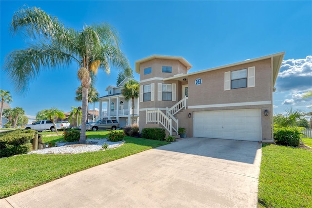 beach home featuring driveway, a front lawn, an attached garage, and stucco siding