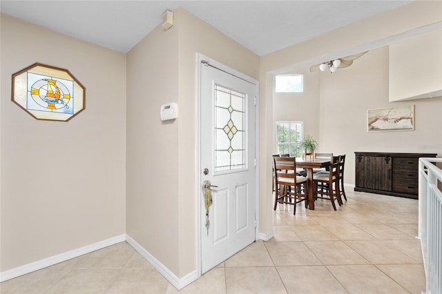 entrance foyer with light tile patterned floors