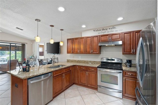 kitchen with under cabinet range hood, a peninsula, a sink, visible vents, and appliances with stainless steel finishes