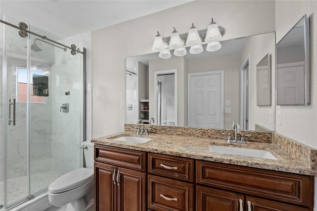 bathroom featuring vanity, toilet, and walk in shower