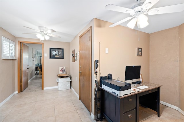 office with light tile patterned floors, ceiling fan, and baseboards