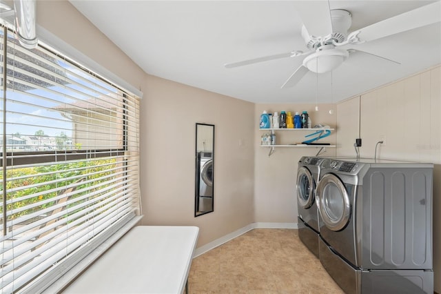 clothes washing area with laundry area, light tile patterned floors, baseboards, washer and clothes dryer, and a ceiling fan