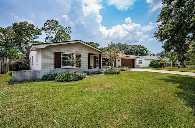 ranch-style house featuring a garage and a front yard