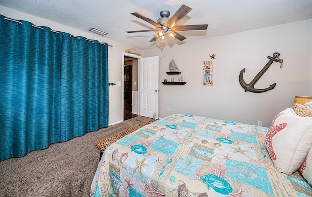 bedroom featuring a textured ceiling, ceiling fan, and carpet floors