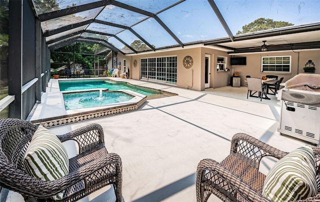 view of swimming pool featuring a lanai, a patio area, area for grilling, ceiling fan, and an in ground hot tub