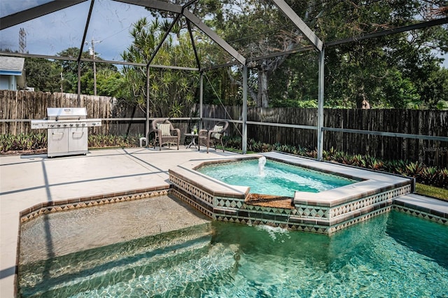 view of pool with a lanai, area for grilling, and an in ground hot tub