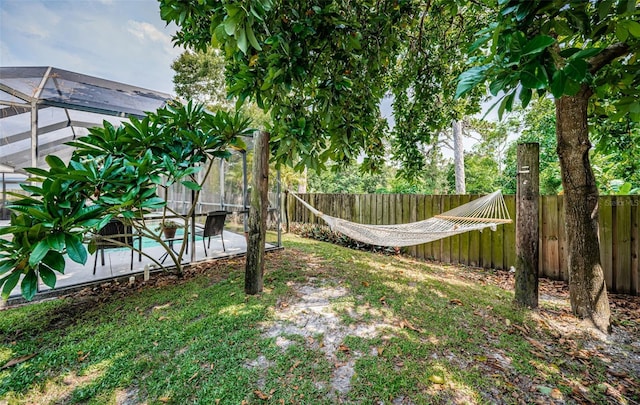 view of yard with a lanai