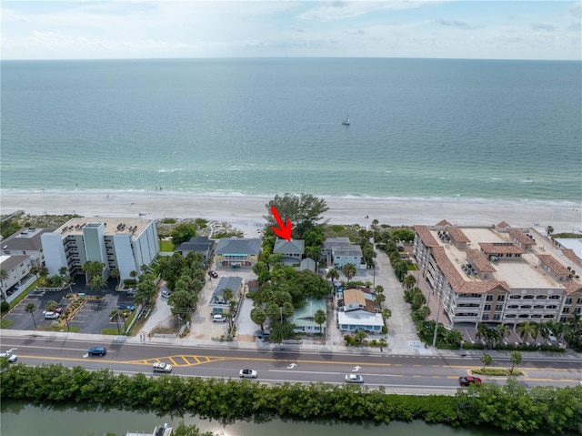 drone / aerial view featuring a view of the beach and a water view