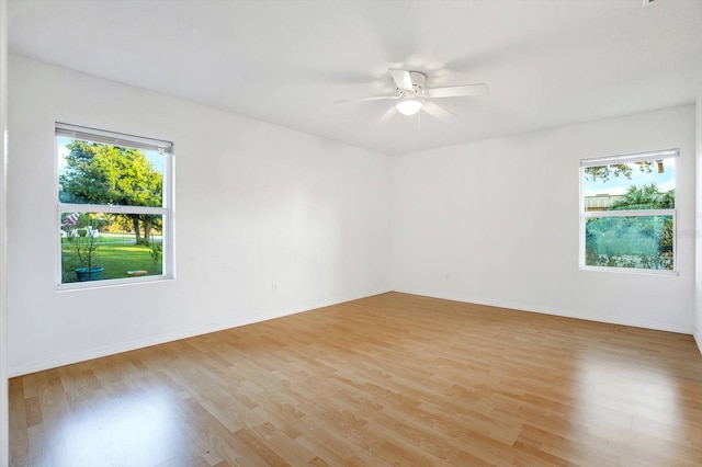 unfurnished room with light hardwood / wood-style flooring and ceiling fan