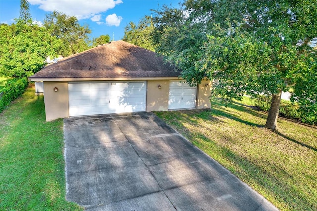 garage with a yard