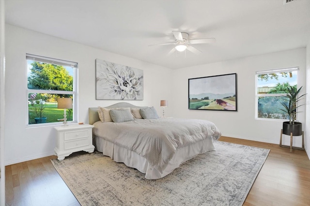 bedroom featuring light wood-type flooring and ceiling fan