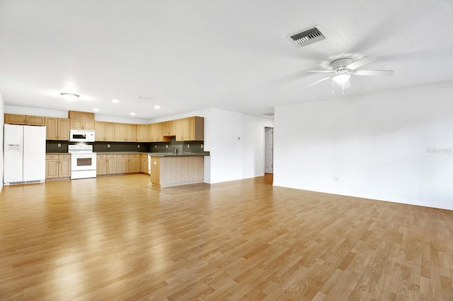 unfurnished living room with light hardwood / wood-style flooring and ceiling fan