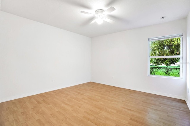 spare room featuring ceiling fan and light hardwood / wood-style flooring