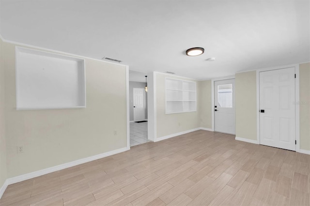 unfurnished room featuring light hardwood / wood-style floors