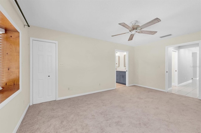 carpeted empty room with ceiling fan