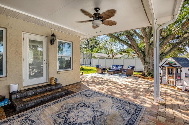 view of patio / terrace featuring ceiling fan