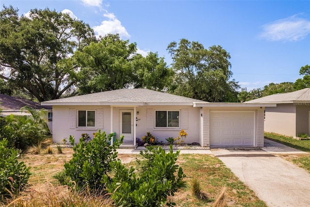 ranch-style home featuring a garage