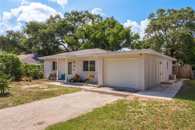 ranch-style house with a front lawn and a garage