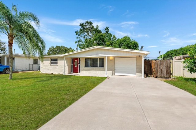 ranch-style home with a garage and a front yard