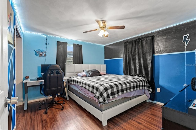 bedroom featuring dark hardwood / wood-style flooring and ceiling fan