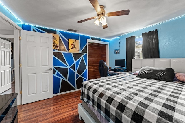 bedroom featuring ceiling fan and wood-type flooring