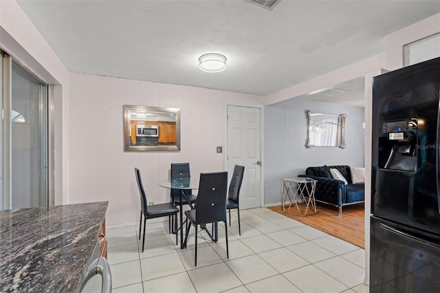 dining room with light hardwood / wood-style floors