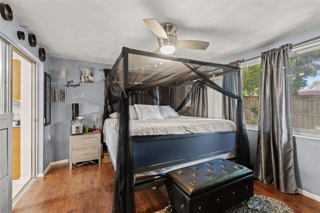 bedroom with ceiling fan and hardwood / wood-style floors