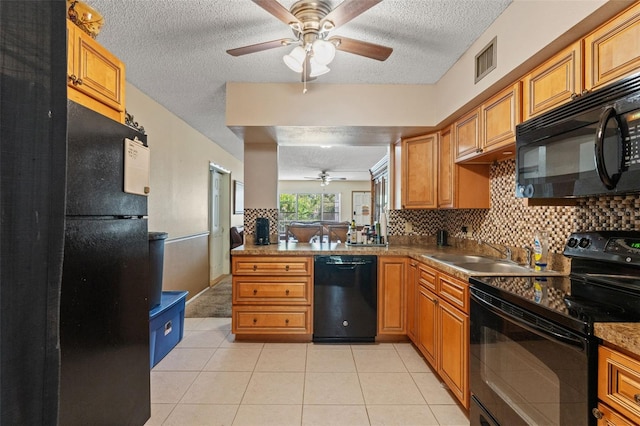 kitchen featuring sink, ceiling fan, decorative backsplash, and black appliances