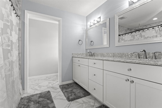 bathroom featuring tile patterned floors, a shower with shower curtain, and vanity