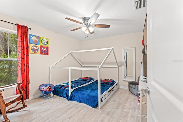 bedroom featuring ceiling fan and light hardwood / wood-style floors