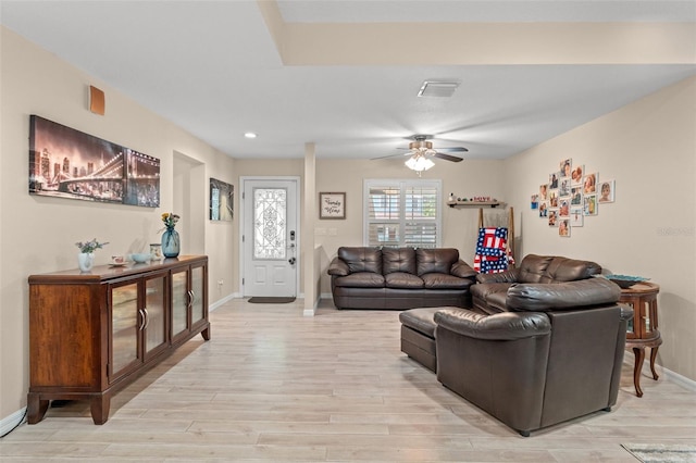 living room featuring light wood-type flooring and ceiling fan